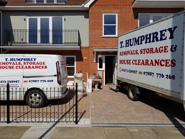 House removals Ipswich Suffolk T. Humphrey removals van and lorry parked outside a house during a home move in Ipswich
